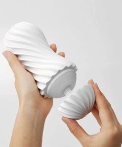 Hands removing the cover from a white Tenga Flex Silky Masturbator