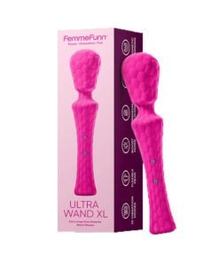 Waterproof pinkÂ Â wand vibrator standing leaning on a box