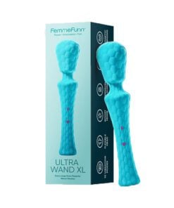 Waterproof turquoise wand vibrator standing leaning on a box