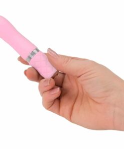 Hand holding a pink Pillow Talk Flirty bullet vibrator