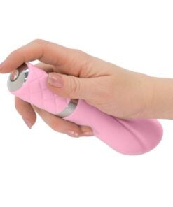 Hand pushing the button of a pink Pillow Talk Sassy g-spot vibrator