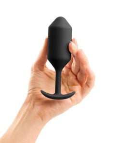 A hand holding the black, large sized B-Vibe Snug plug