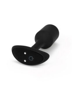 A side view of the black B-vibe snug plug showing the power charging terminal