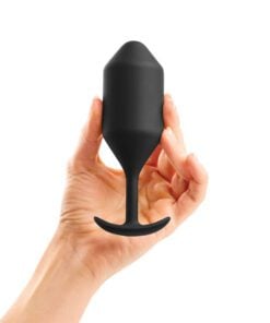 Hand holding a Extra Large Black Snug Plug