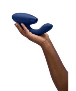 Hand holding the Womanizer Duo Vibrator in Blue