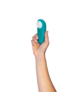 Hand holding the TurquoiseÂ Womanizer Starlet 3Â Air Pulse Vibrator